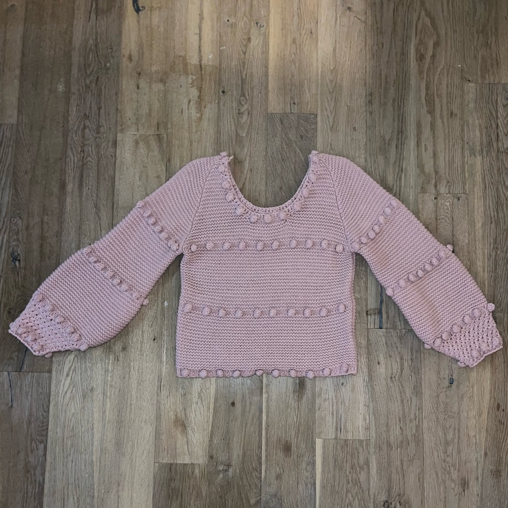 Sweater with pom-poms